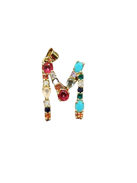 the “M” jeweled pendant